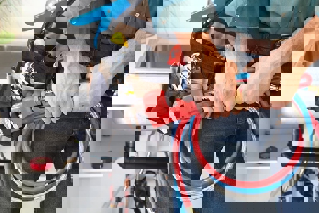 a plumbing technician getting ready with his tools