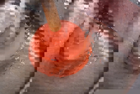 an orange plunger