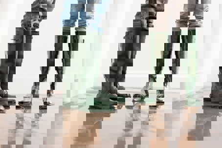 two peaople wearing boots